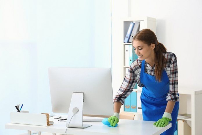 Cleaning concept. Young woman cleaning office cleaning person