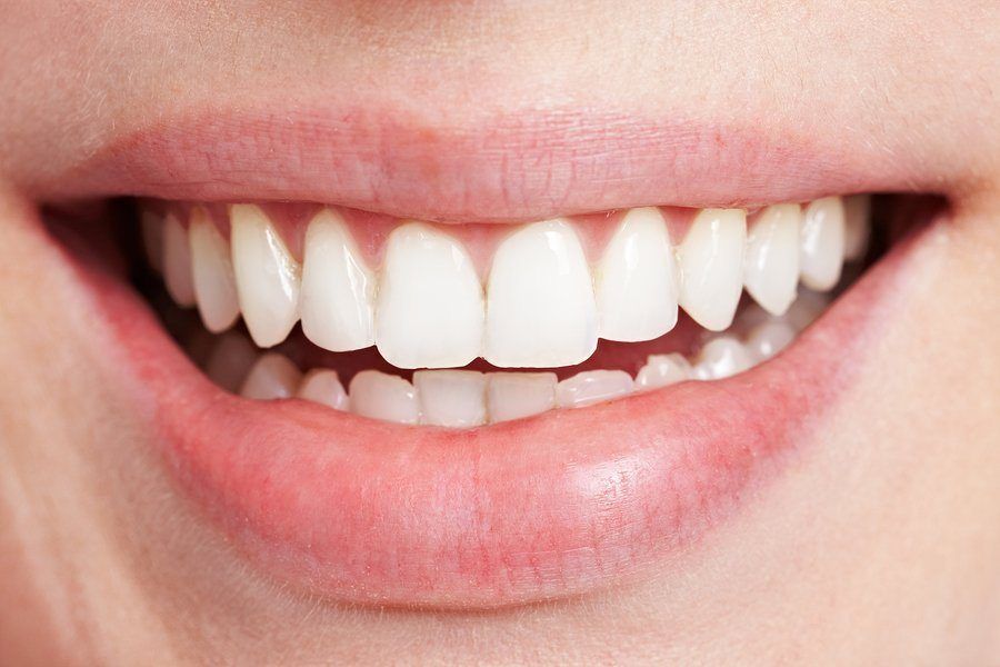 Happy smiling female mouth with white teeth