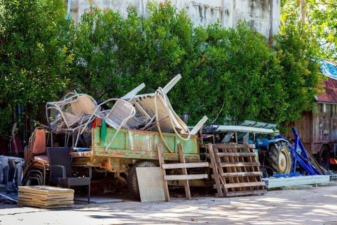 dirty grunge cluttered beside house wall recycle rubbish removal