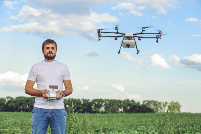 Man-Using-Drone used to make deliveries
