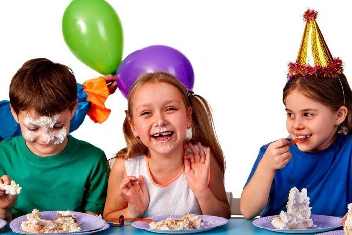 Birthday children celebrate party and eating cake on plate toget Party supplies