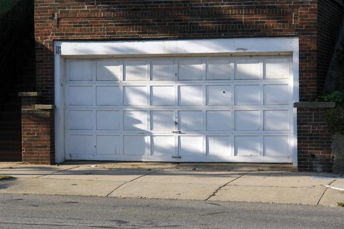 What are the real dangers of using a garage door that is too old