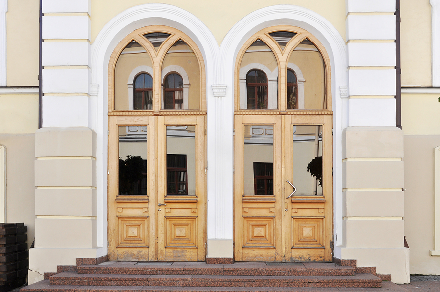 Two old beautiful wooden doors with glass decorative elements. Grodno, Belarus.