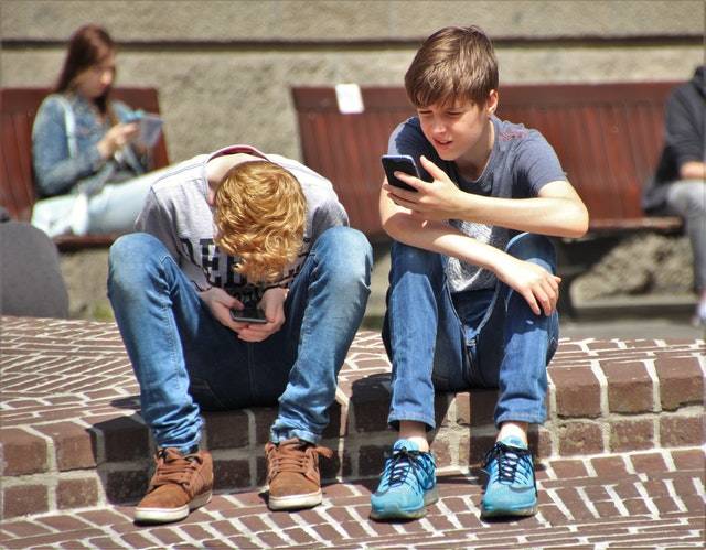 Kids on their phones