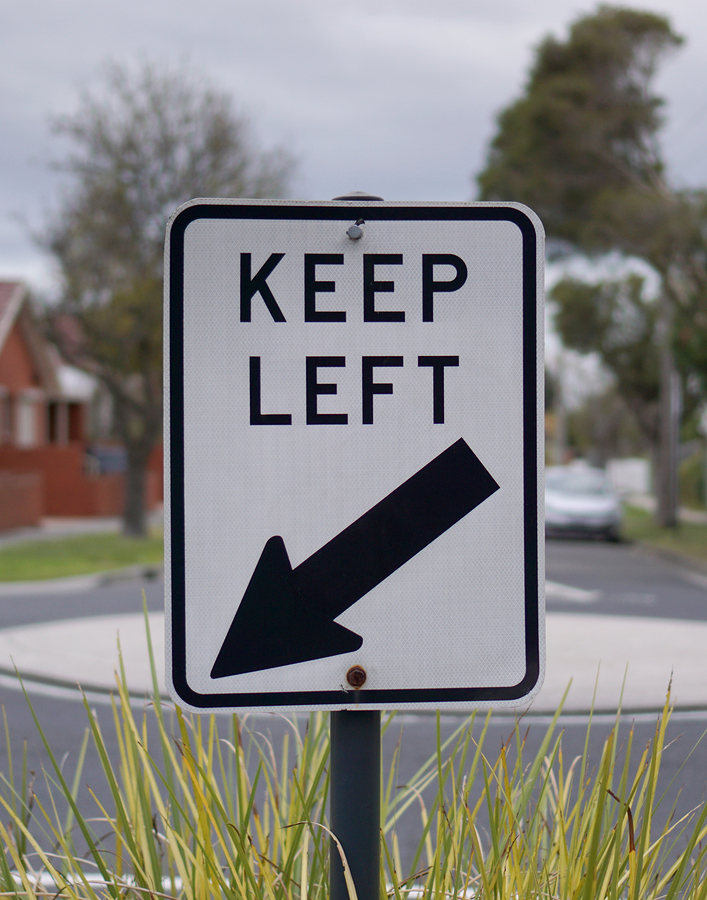 Keep left traffic sign in white and black color