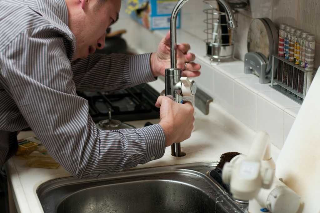 Plumber working on bathroom