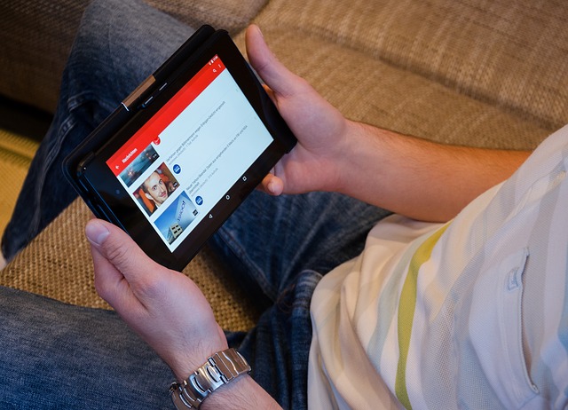 Holding YouTube tablet