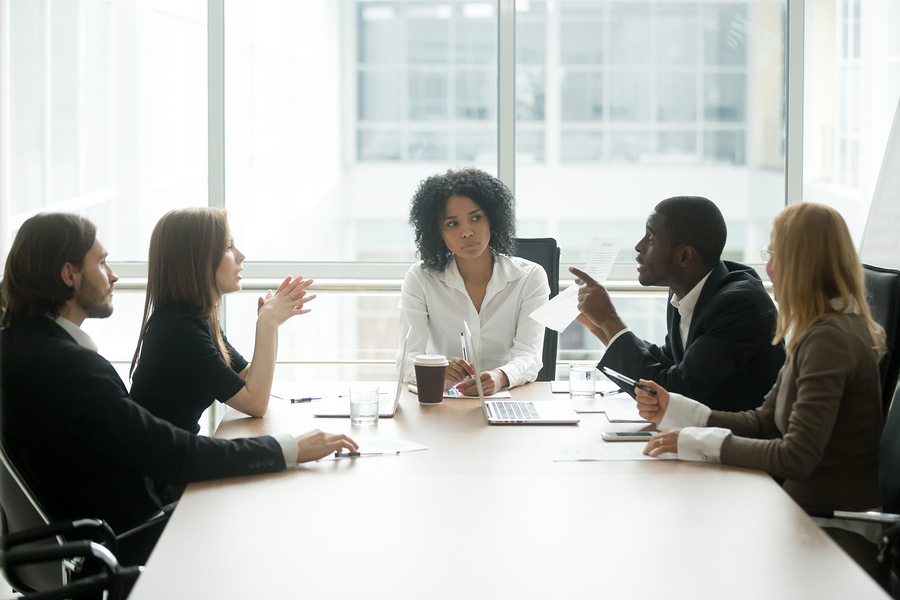 Multiracial people having dispute about bad document at group meeting, african businessman disagreeing with contract terms at multi-ethnic negotiations in lawyers office, fraud or legal fight concept