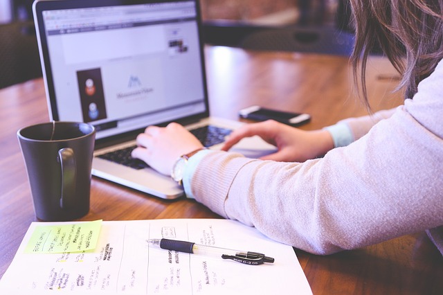 Woman typing on computer