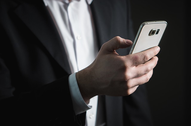 Man using email on phone