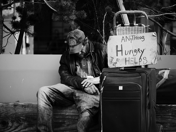 Homeless man with belongings