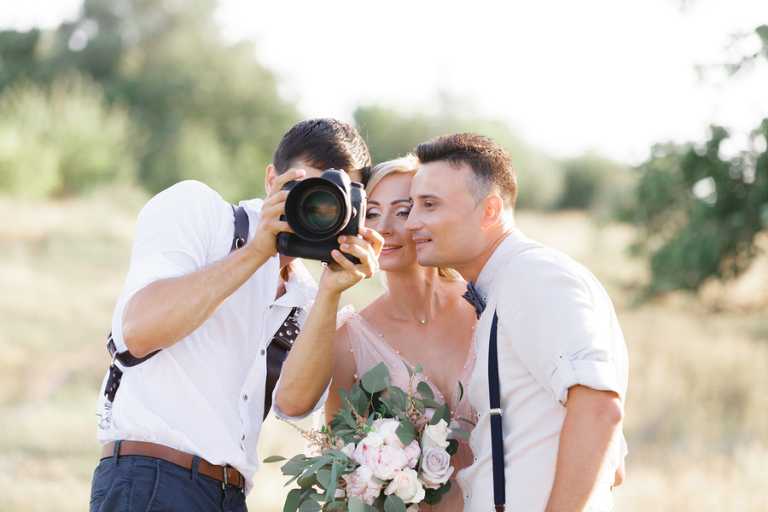 How do photographers prepare for a wedding shoot