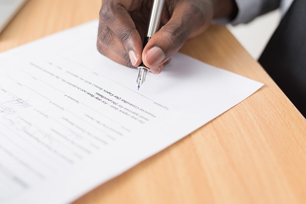 Signing documents certifying academic records