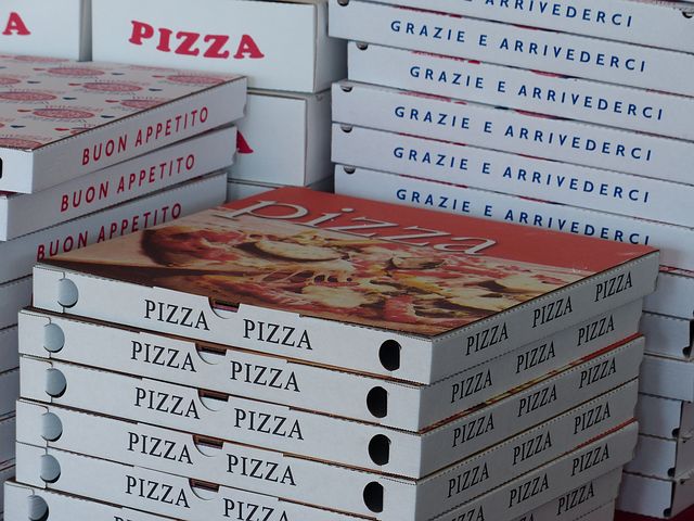 Boxes of pizza ready for delivery.