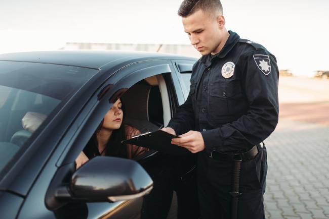 Cop in uniform checks license