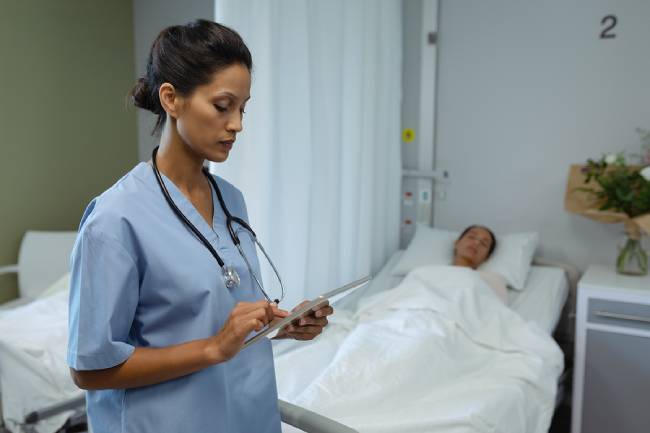 Doctor monitoring a sleeping patient