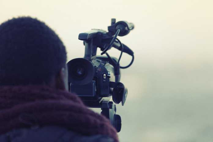 Best Videographers in Newcastle A videographer holding his camera while shooting
