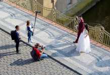 Wedding photographer and his team taking prenup photos with the couple.