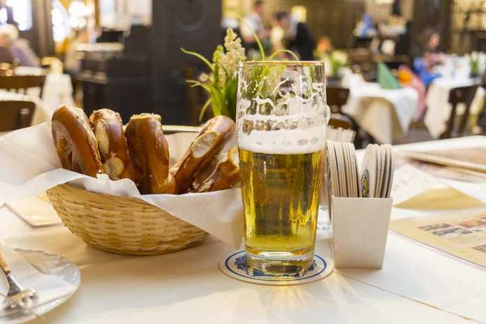 Classic German dinner of fried sausages with light beer.