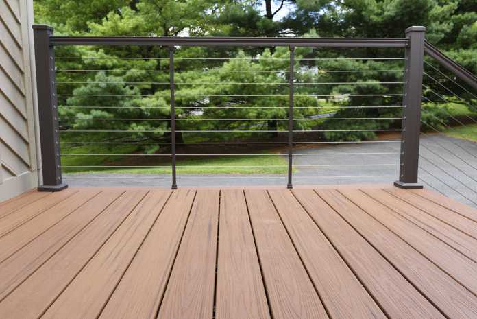 New Deck With Metal Wire Railing - Composite Wood How heat affects your composite decking