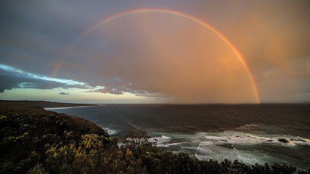 adventuring Australia rainbow over coastal waters