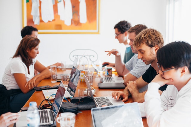 work team motivated laptop meeting