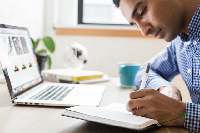 Conveyancing lawyer writing using ballpoint pen