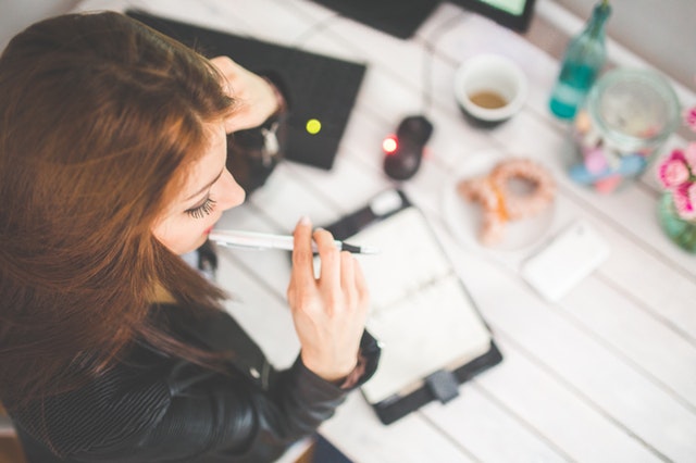 Young woman freelancing at desk