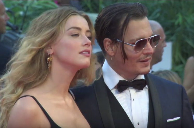 Amber Heard admits “hitting” Johnny Depp in explosive audio