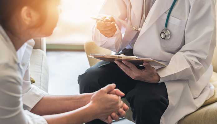 Woman Patient With Doctor Or Psychiatrist Consulting And Diagnos healthcare assistants when advising patients on preparing for surgery