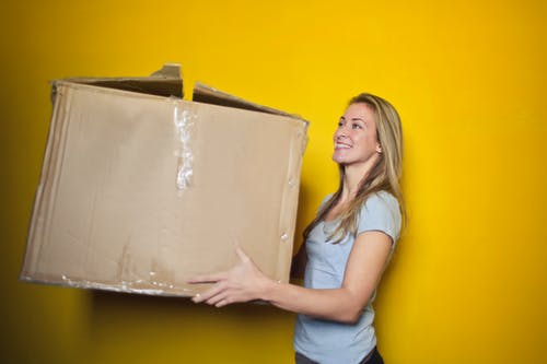 woman holding a big box