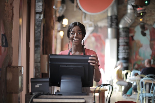 A woman at a point of sale system.