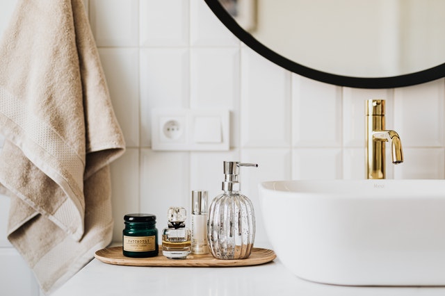 A bathroom with cosmetic products from a best wholesaler on the bench.