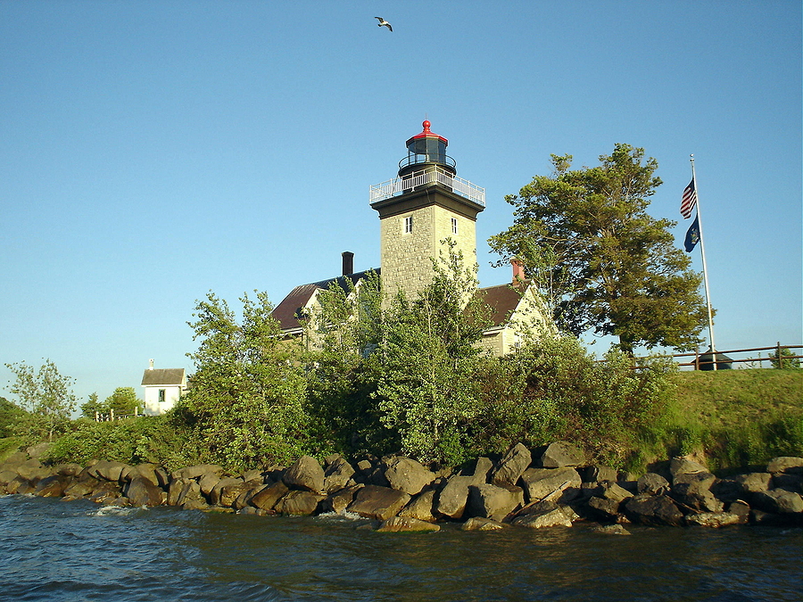 Lighthouse with a Seagull soaring Above. Golden Hill State Park